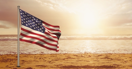 Digital composite of USA flag in the beachの写真素材