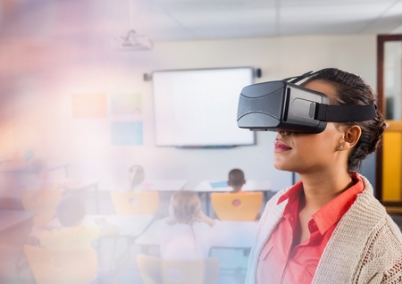 Digital composite of Teacher wearing Virtual reality headset in class