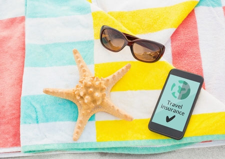 Digital composite of Phone with travel insurance concept on screenの写真素材