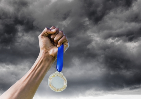 Digital composite of Man with a trophy on handsの写真素材