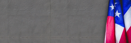 Digital composite of USA flag against grey background