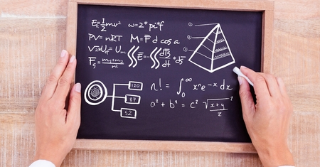 Digital composite of Hand drawing diagrams on blackboard