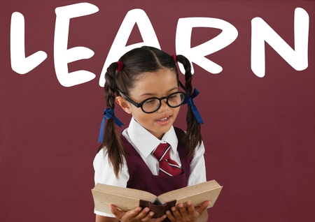 Digital composite of Student girl at table against red blackboard with learn text