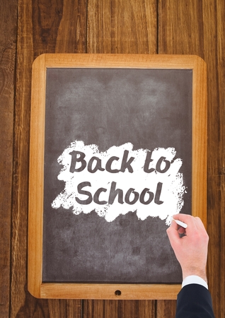 Digital composite of Hand writing back to school text on blackboardの写真素材