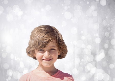 Digital composite of Boy with bright bokeh backgroundの写真素材