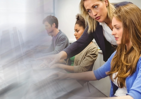 Digital composite of teacher with class on computers