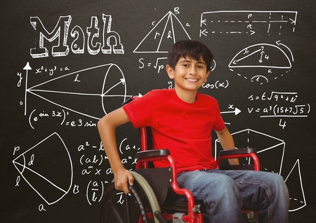Digital composite of Disabled boy in wheelchair in front of blackboard with math equationsの写真素材