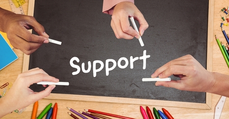 Digital composite of Hands writing support on blackboardの写真素材