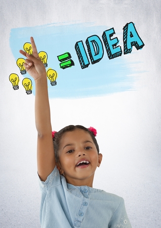 Digital composite of Girl reaching hand up with colorful idea light bulb graphicsの写真素材