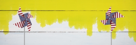 Digital composite of USA wind catchers in front of woodの写真素材