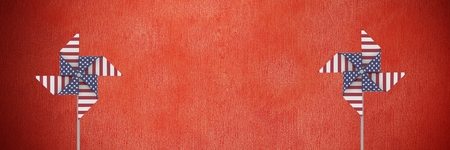 Digital composite of USA wind catchers in front of red wallの写真素材