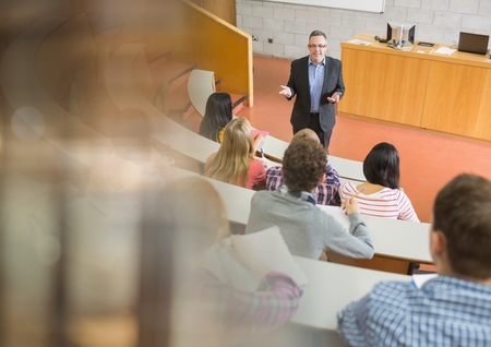 Digital composite of University teacher with class