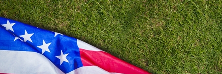 Digital composite of USA flag on grassの写真素材
