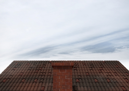 Digital composite of Roof with chimney and skyの写真素材