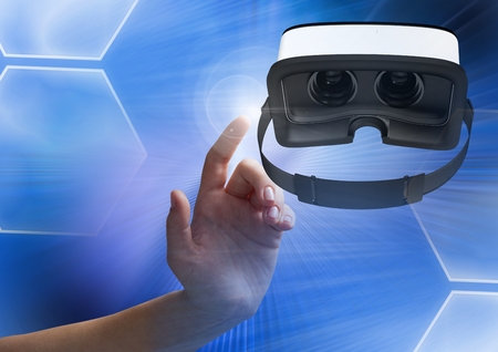 Digital composite of Hand touching and interacting with virtual reality headset with transition...