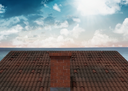 Digital composite of Roof with chimney and ocean skyの写真素材
