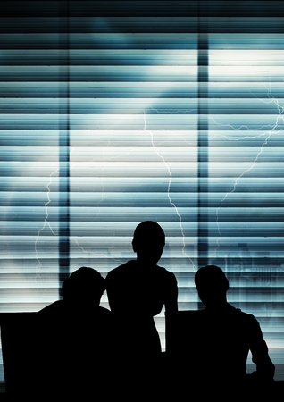 Digital composite of Business people silhouettes against buildingの写真素材