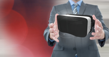 Digital composite of Hands touching and interacting with virtual reality headset with transition effectの写真素材