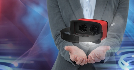 Digital composite of Hands open and interacting with virtual reality headset with transition effect