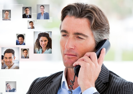 Digital composite of Man holding phone with Profile portraits of people contactsの写真素材