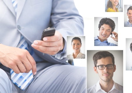 Digital composite of Man holding phone with Profile portraits of people contactsの写真素材