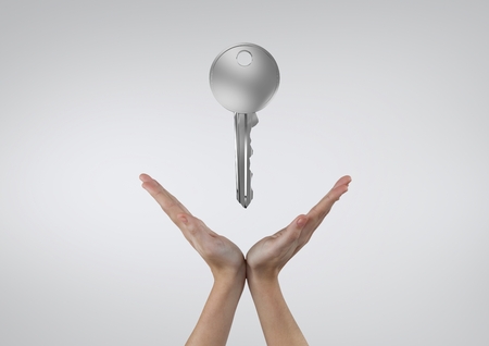 Digital composite of Hand holding keysの写真素材