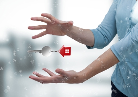 Digital composite of Business man holding keysの写真素材