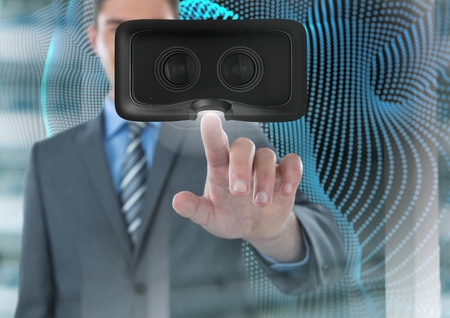 Digital composite of Man touching and interacting with virtual reality headset with transition effectの写真素材