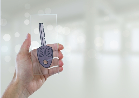 Digital composite of Business man holding a glass with keys icons