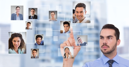 Digital composite of Businessman interacting and choosing a person from group of people interfaceの写真素材