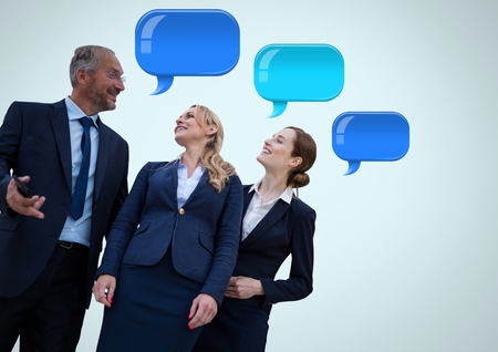 Digital composite of Business people with shiny chat bubblesの写真素材