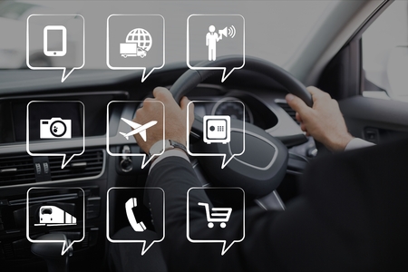 Digital composite of Phone icons against person in the carの写真素材