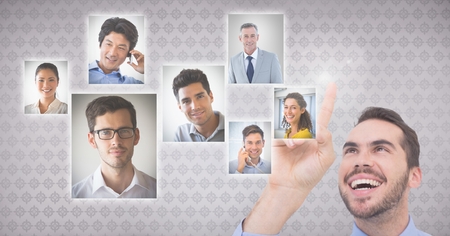 Digital composite of Businessman interacting and choosing a person from group of people interfaceの写真素材