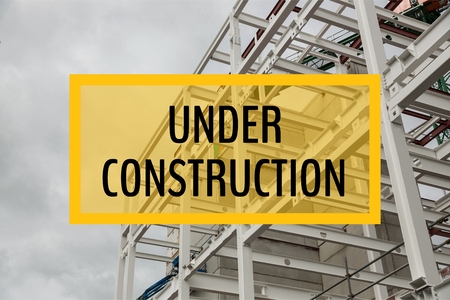 Digital composite of Under construction text against construction photoの写真素材