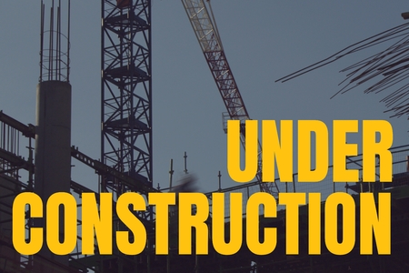 Digital composite of Under construction text against construction photoの写真素材