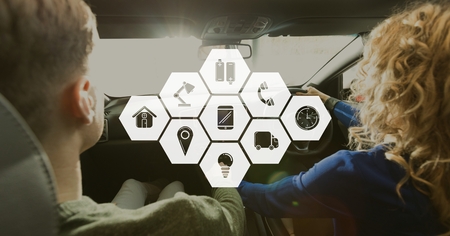 Digital composite of Icons against couple in the car