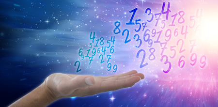 Hand of man pretending to hold an invisible object against digitally composite image of colorful lightsの写真素材