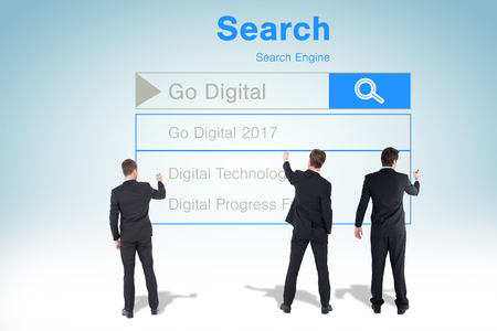 Business team writing against white background against grey vignetteの写真素材