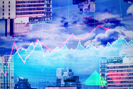 Stocks and shares against buildings against mountainの写真素材