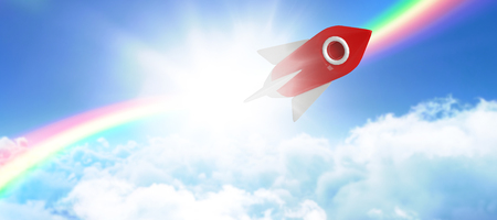 White and red spaceship toy against idyllic view of cloudscape against skyの写真素材