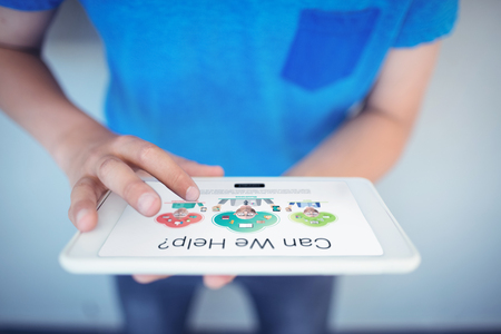 Human representations with can we help text against schoolboy using digital tablet in corridorの写真素材