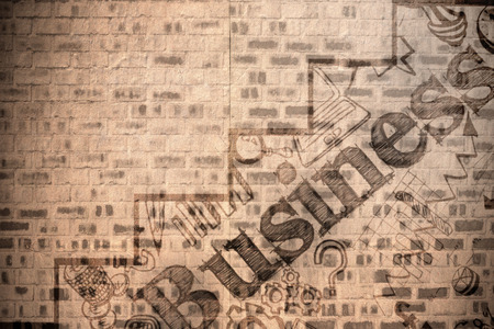 Graphic image of business text with graph against stone wallの写真素材