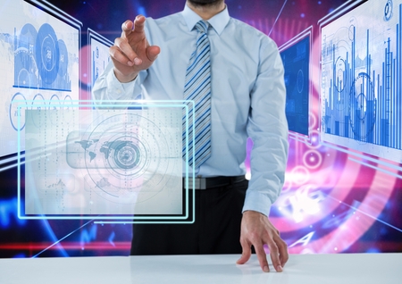 Digital composite of Businessman touching and interacting with technology interface panelsの写真素材