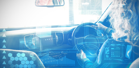 Digital interface against woman test driving at showroomの写真素材