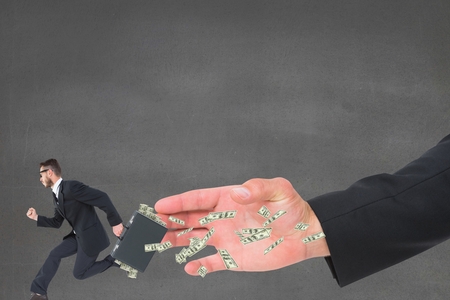Digital composite of Hand trying to catch a small business man runningの写真素材