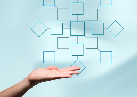 Digital composite of Hand and mind map over bright backgroundの写真素材