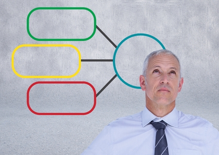 Digital composite of Businessman and Colorful mind map over bright backgroundの写真素材