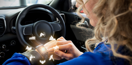 Graphic image of various sports activities against close up of woman using smart watch in carの写真素材