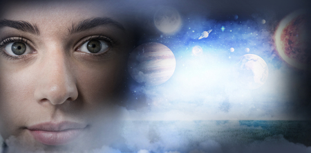 Composite image of solar system against white background against high angle view of illuminated crowded cityscapeの写真素材