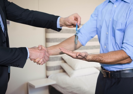 Digital composite of Holding key in bedroomの写真素材